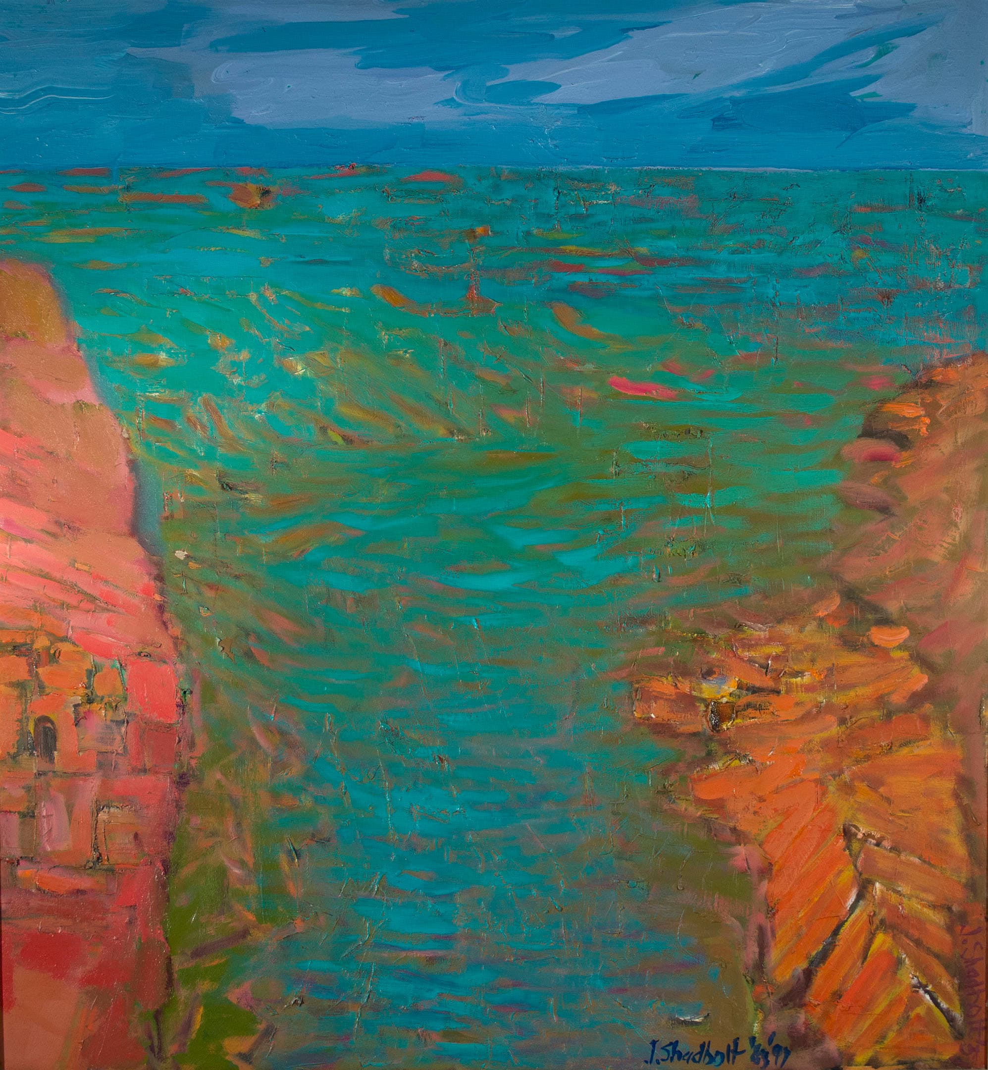 An abstract painting depicting a coastal scene with vibrant colors. The left side features rocky cliffs in shades of red and orange, while the right side shows a calming turquoise ocean. The sky above is painted in soft blues with wispy white clouds. Bold brushstrokes create a textured appearance in both the water and the rocks.