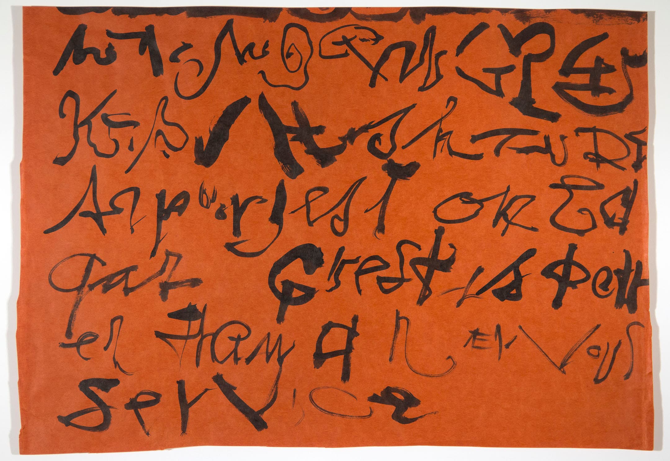 An abstract artwork featuring various styles of black calligraphy on an orange background. The text appears to be a mixture of letters and shapes, with some characters resembling cursive and others resembling symbols. The overall composition is dynamic, with the text flowing in different directions across the page.