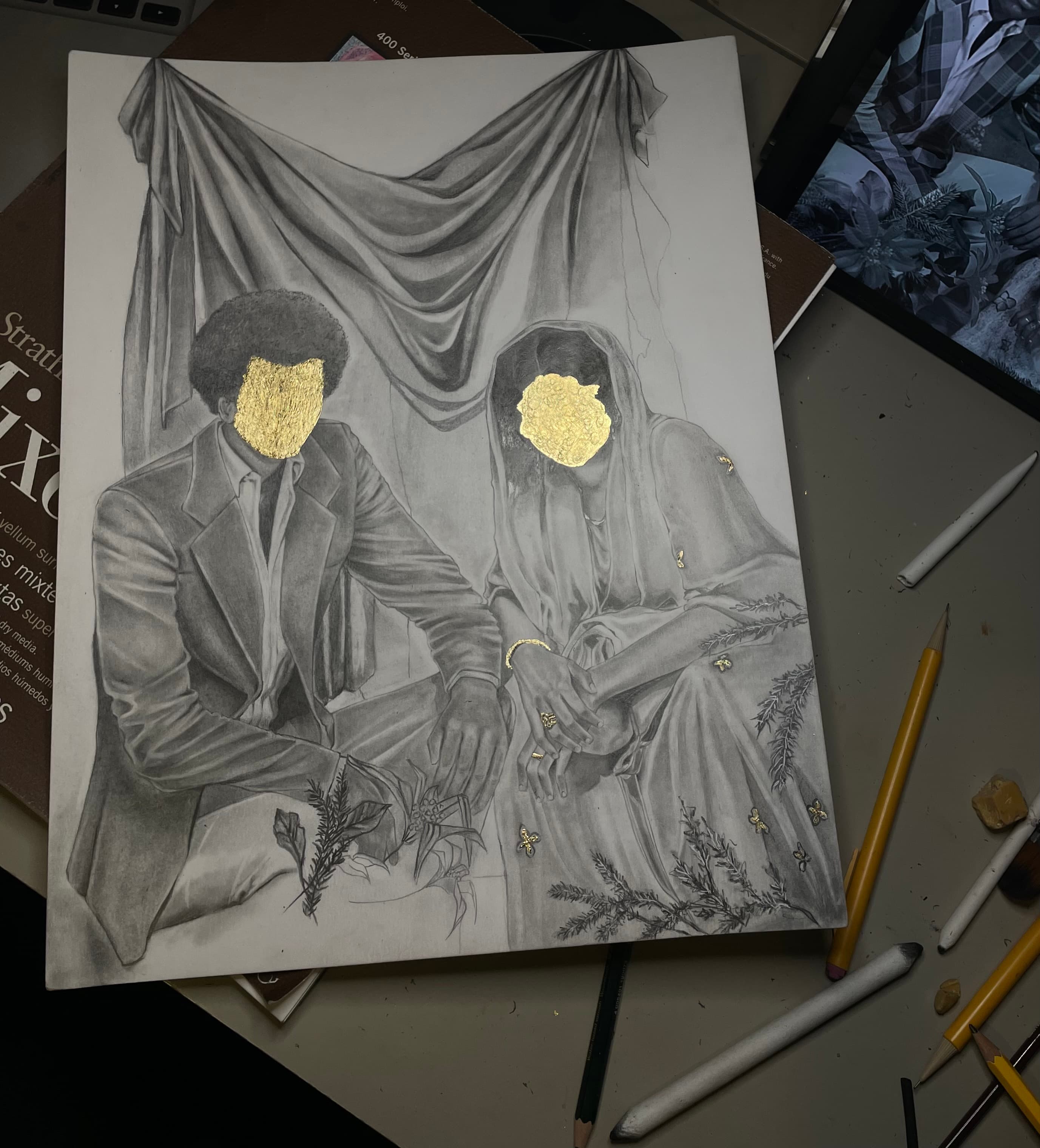 A detailed pencil drawing of a seated couple, partially obscured by gold shapes over their faces. The man is wearing a suit and the woman is dressed in a flowing garment, decorated with floral patterns. They are positioned against a backdrop of draped fabric. Surrounding the couple are sketches of plants and scattered art materials, including pencils and erasers, on a work surface.