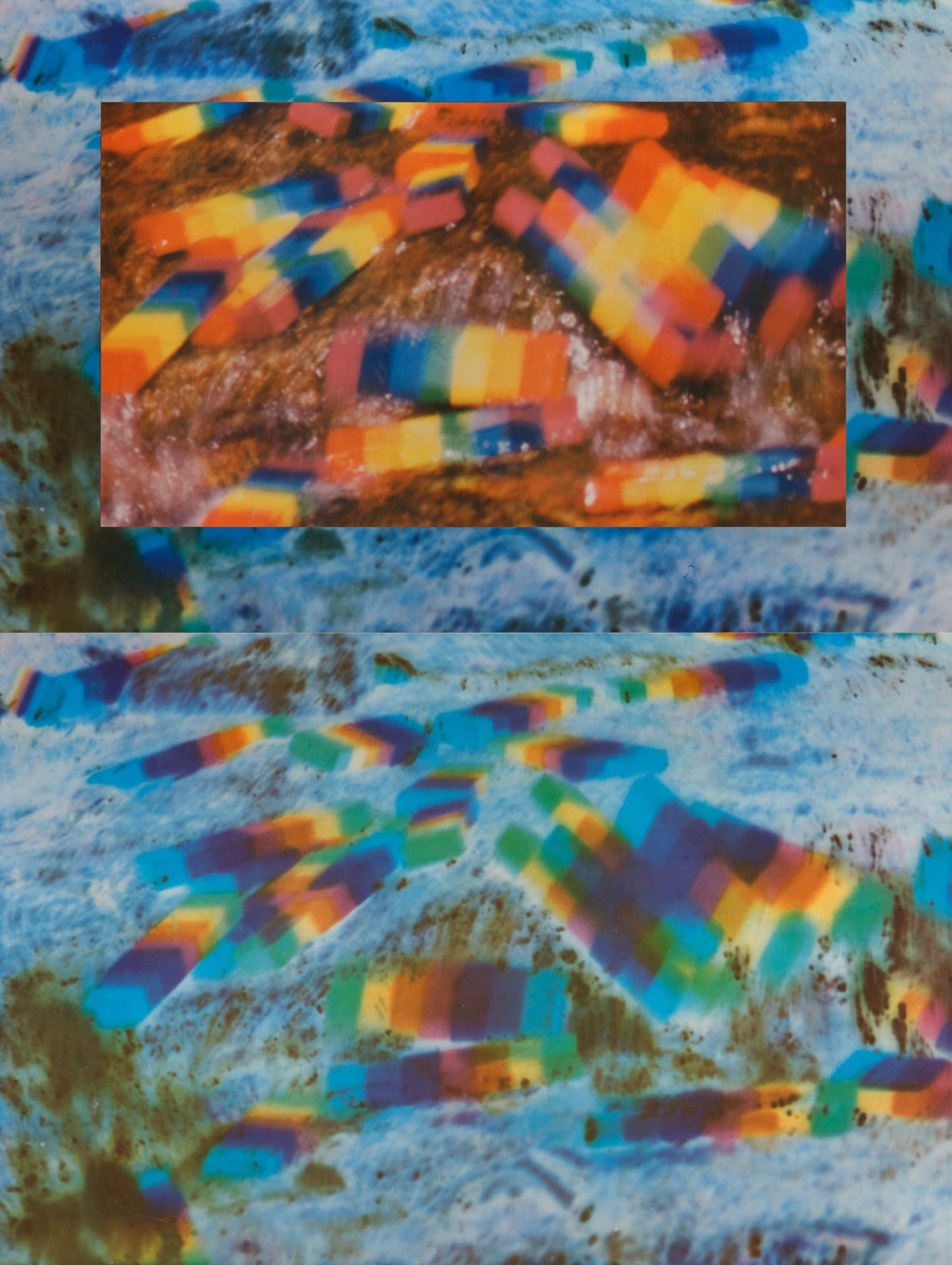 An abstract image displaying vibrant, rainbow-colored patterns resembling geometric shapes scattered across a textured surface. The top portion features a close-up inset of similar colorful shapes. The background consists of a mix of blue and earthy tones, enhancing the visual contrast. The overall composition conveys a sense of movement and fluidity.